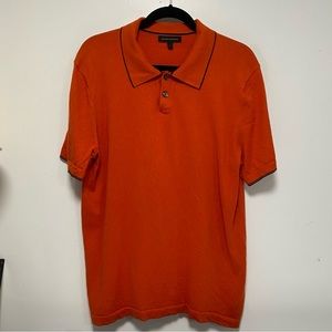 Orange with navy blue trim polo style shirt